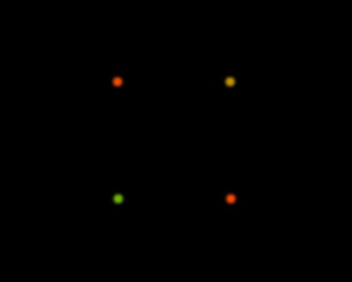 Pairs of coloured lantern test lights on a black background