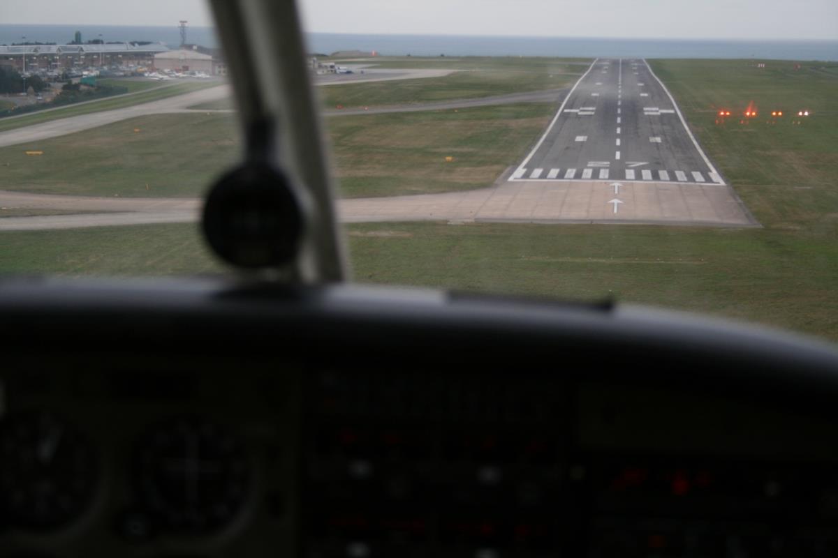 View of a runway on final approach from the cockpit