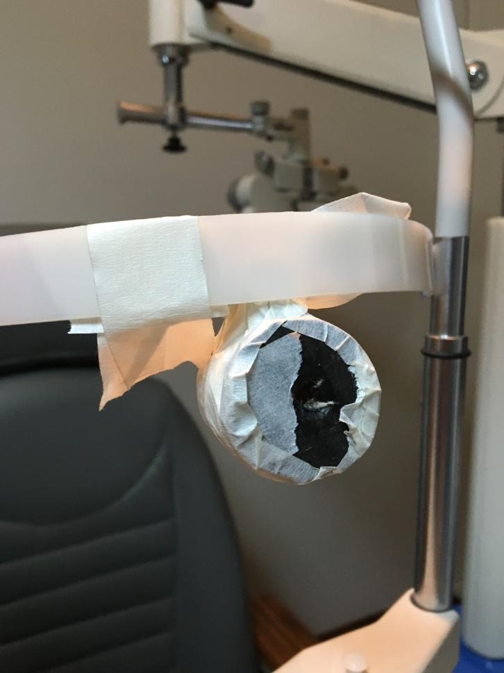 Practice eye taped to the slit lamp head rest