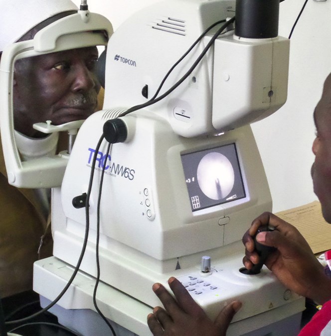 Patient having retinal photography with a fundus camera